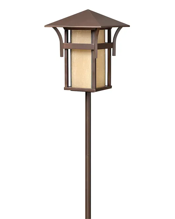 The Harbor LED Path Light brings lighthouse-inspired design to outdoor spaces with clean lines and warm amber glass. Energy-efficient LED technology delivers 25,000 hours of maintenance-free illumination at 2700K.