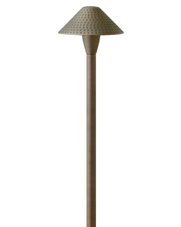 The Hardy Island Path Light combines rugged construction with refined design. Solid cast brass construction ensures longevity in wet locations, while the clear glass and warm LED create inviting illumination for walkways and outdoor spaces.