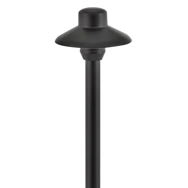 The Hardy Island path light combines solid cast brass construction with a sophisticated satin black finish, designed to withstand extreme weather while providing warm LED illumination for walkways and outdoor spaces.