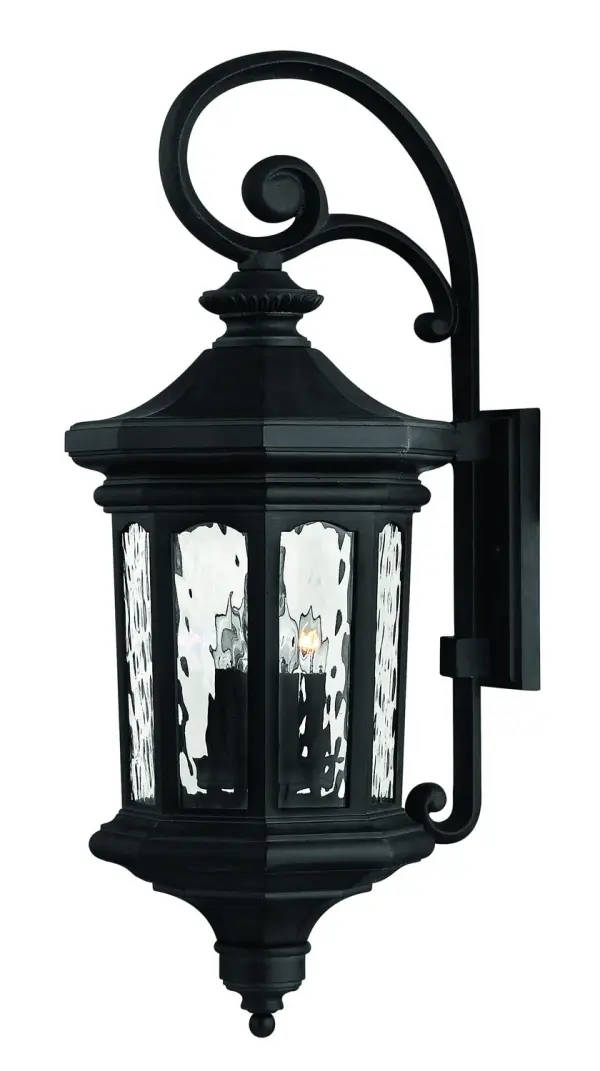 The Raley LED wall mount combines classic elegance with modern LED technology. Its cast aluminum construction and flourishing details create a dignified presence, while clear water glass panels provide beautiful light diffusion.