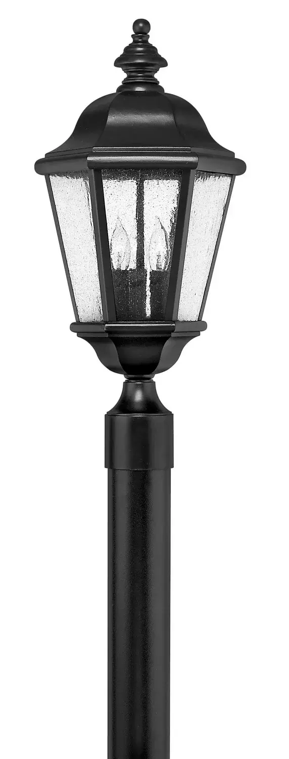 The Edgewater LED Post Lantern combines timeless design with modern LED technology. Its cast aluminum and brass construction ensures durability in outdoor conditions, while the clear seedy glass adds vintage charm.