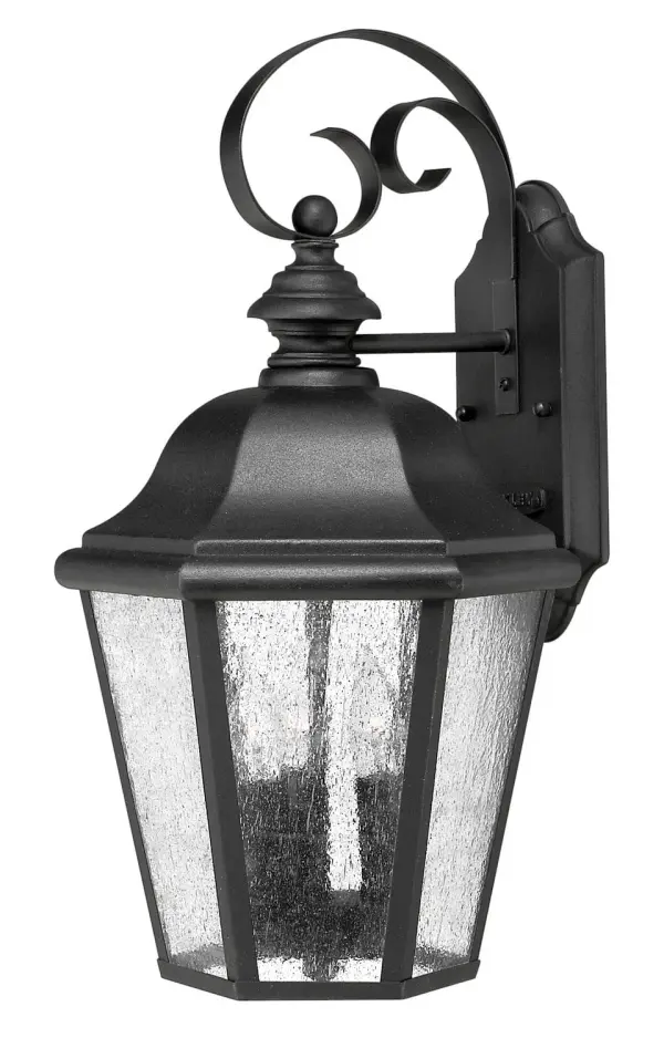 The Edgewater LED wall sconce combines traditional design with modern LED efficiency. Its cast aluminum and brass construction ensures durability in outdoor conditions, while the clear seedy glass adds vintage character.