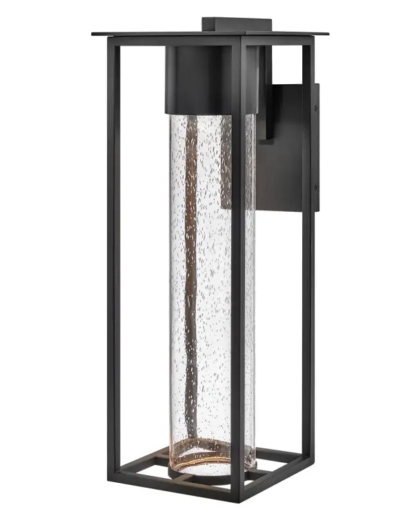 The Coen LED wall sconce combines classic design with contemporary efficiency. Clear seedy glass creates a warm, radiant glow while the durable composite construction withstands harsh weather. Dark Sky compliant and wet-rated for complete outdoor protection.