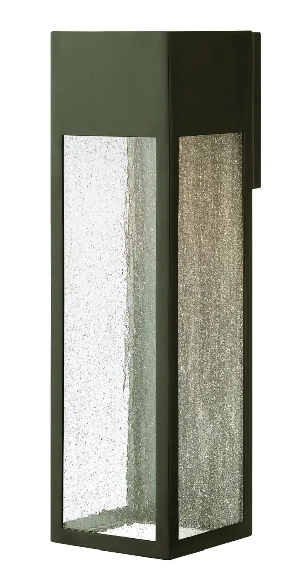 The Rook LED wall sconce delivers commanding modern style with its clean lines and sturdy aluminum frame. The downlight creates dramatic wall-grazing effects through clear seedy glass, while wet-rated construction ensures reliable outdoor performance.