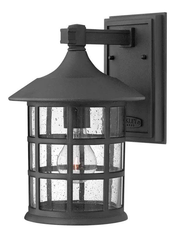 The Freeport LED wall sconce combines timeless traditional design with energy-efficient LED technology. Cast aluminum construction ensures durability in all weather conditions, while clear seedy glass adds vintage charm.