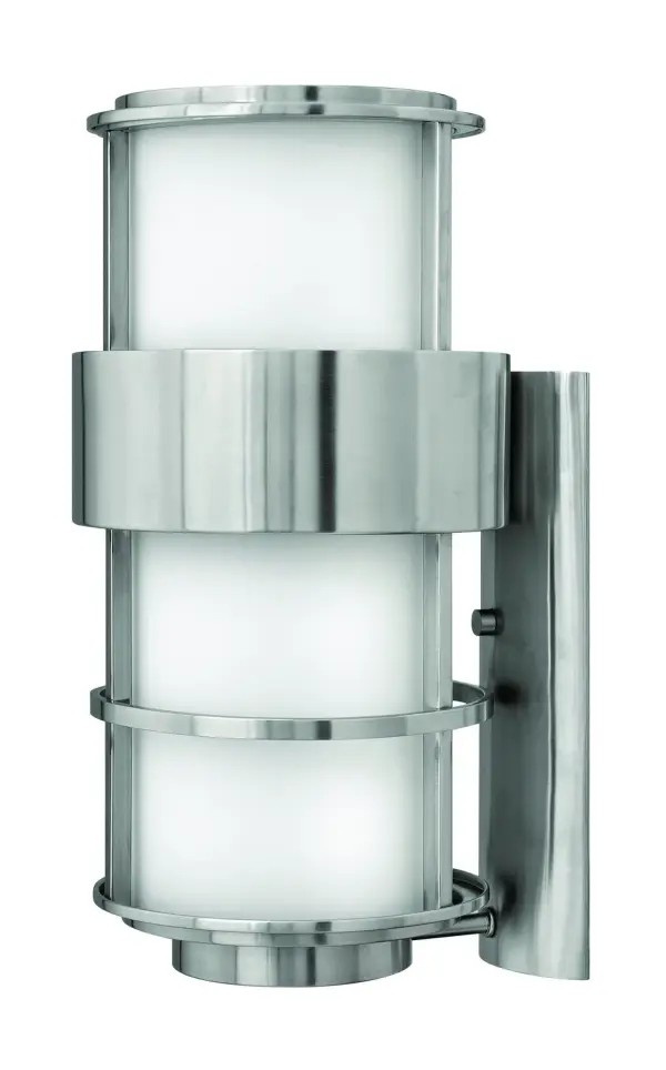 The Saturn LED Wall Mount combines striking geometric design with durable stainless steel construction. Its intersecting lines and etched opal glass create dramatic visual interest while providing reliable outdoor illumination.
