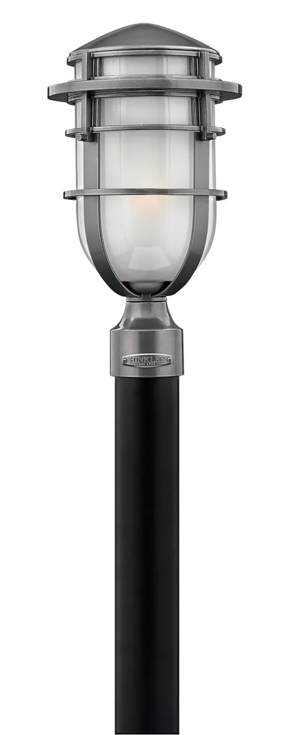 The Reef LED post mount combines modern nautical aesthetics with practical outdoor lighting. Its distinctive capsule-shaped etched glass and bold aluminum rings create visual interest while providing reliable wet-rated illumination.