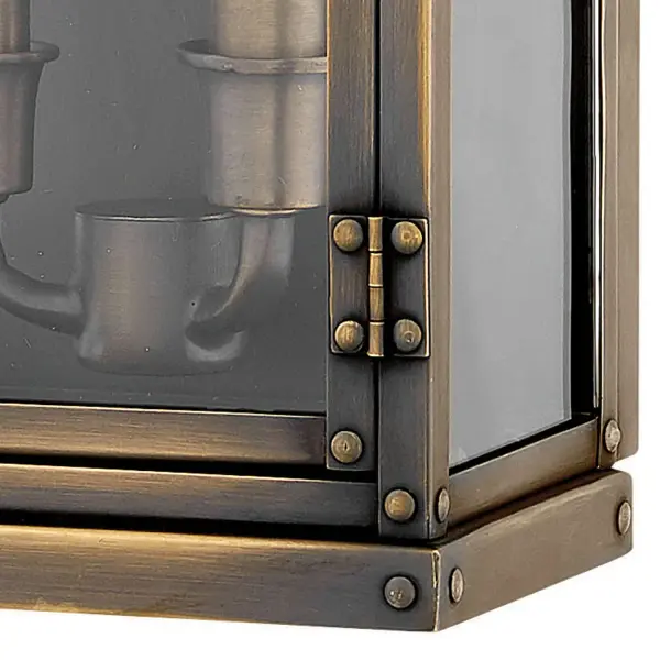 Hamilton’s sleek profile, constructed of solid brass, blends classic early American style with industrial influence. Quality and artistry is at the core of this design, with the pocket lantern featuring prominent rivets and a functional door in its gleaming, authentic Dark Antique Brass finish.