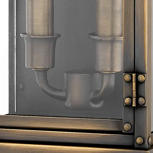 Hamilton’s sleek profile, constructed of solid brass, blends classic early American style with industrial influence. Quality and artistry is at the core of this design, with the pocket lantern featuring prominent rivets and a functional door in its gleaming, authentic Dark Antique Brass finish. - alternate view
