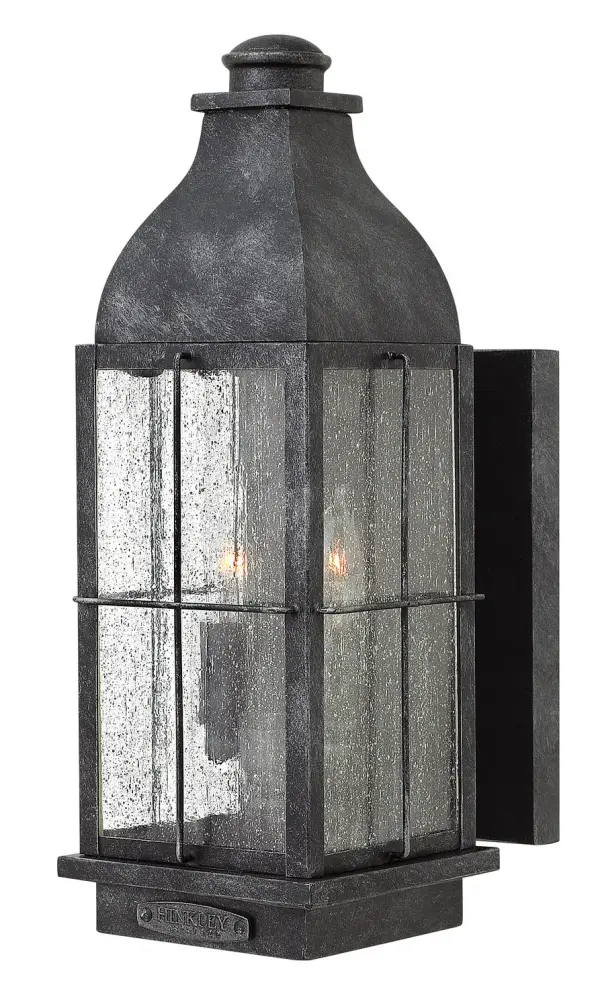 The Bingham LED Wall Mount combines turn-of-the-century gas light aesthetics with contemporary LED technology. Its aluminum construction and clear seedy glass deliver authentic vintage appeal with wet-rated durability for coastal and outdoor applications.