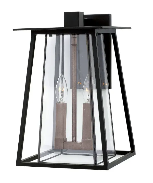 Walker combines rugged American West aesthetics with modern LED efficiency. Its angular aluminum and brass construction with two-tone finish creates architectural interest while the wet-rated design ensures durability in any weather.
