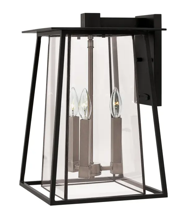 The Walker LED Wall Mount combines rugged American West aesthetics with modern LED efficiency. Its angular aluminum and brass construction with two-tone finish creates a striking statement on any exterior wall.