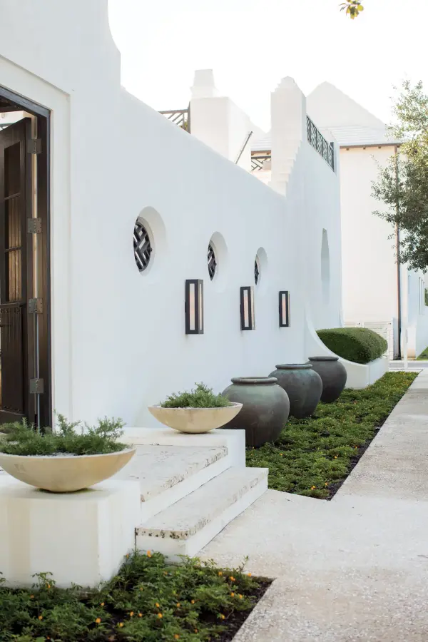 Dorian’s robust design in durable aluminum construction is offered in either Titanium or Bronze finishes. This contemporary fixture allows light to emit from clear painted white etched glass windows. - alternate view