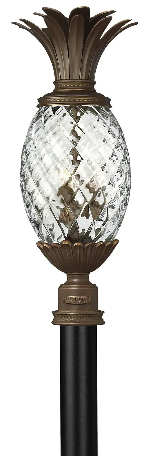 The Plantation LED Post Lantern combines ornate cast brass detailing with energy-efficient LED technology. Its signature pineapple-shaped elements and clear optic glass create sophisticated curb appeal with timeless charm.
