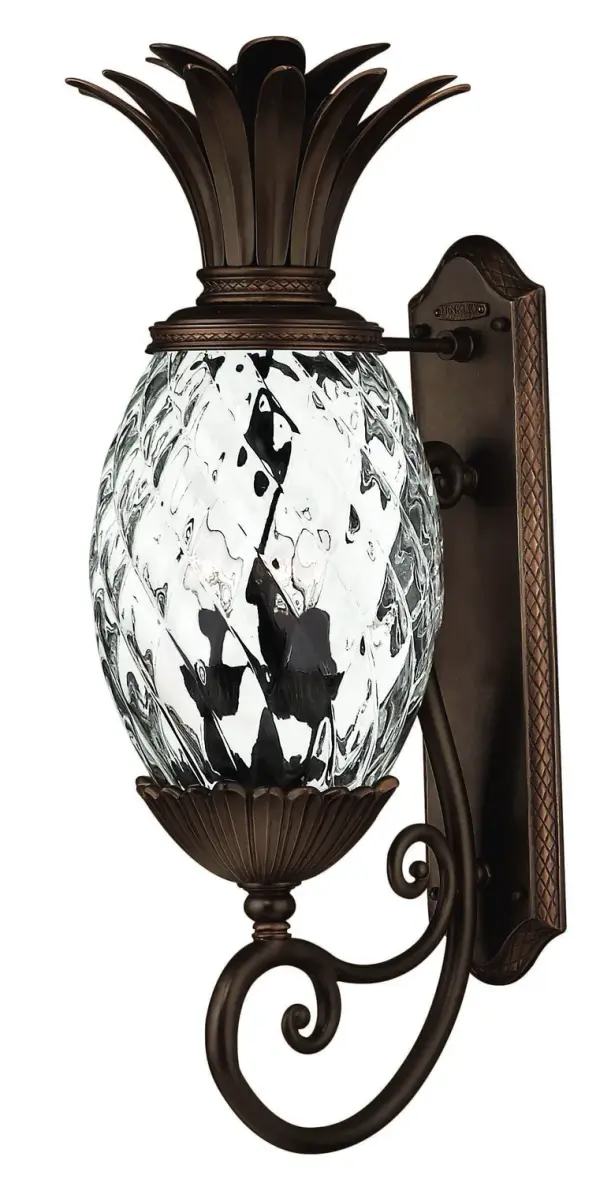The Plantation collection delivers sophisticated outdoor lighting with elaborate cast brass detailing and iconic pineapple motifs. Wet-rated LED technology ensures durability and energy efficiency for coastal and traditional homes.