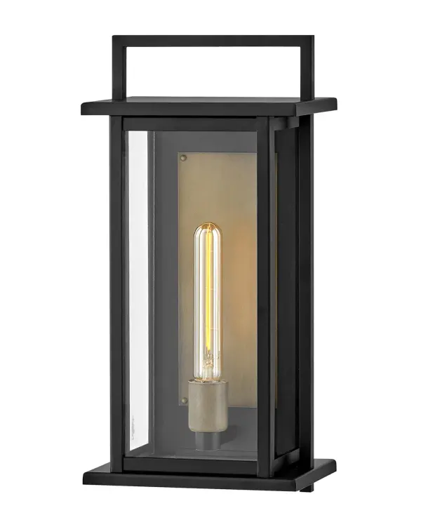 The Langston LED Wall Mount combines sleek modern design with commanding presence. Its oversized clear glass panes and contrasting black-and-bronze finish create dramatic visual impact while delivering excellent illumination.