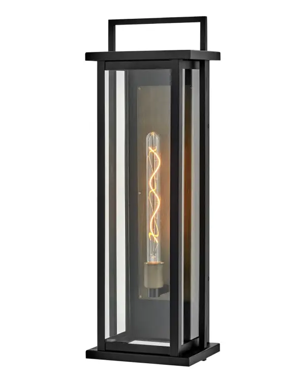 The Langston LED wall mount makes a dramatic statement with its oversized 28-inch height and bold black finish accented by a burnished bronze reflector. Clear glass panes deliver exceptional light output while the wet-rated aluminum construction ensures durability in any outdoor setting.