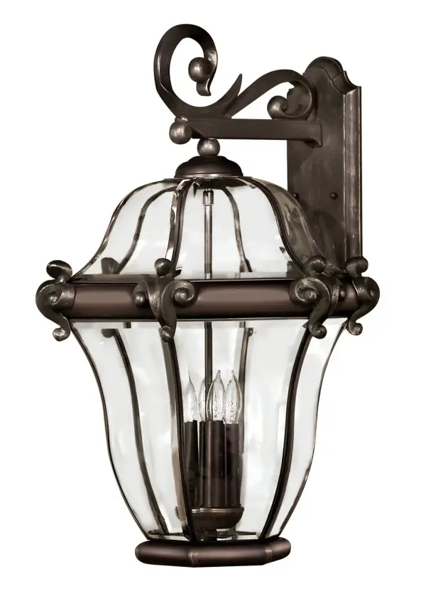 The San Clemente LED wall sconce combines Old World charm with modern LED efficiency. Its cast aluminum and brass construction features ornamental detailing and distinctive beveled glass panels that create beautiful light patterns.