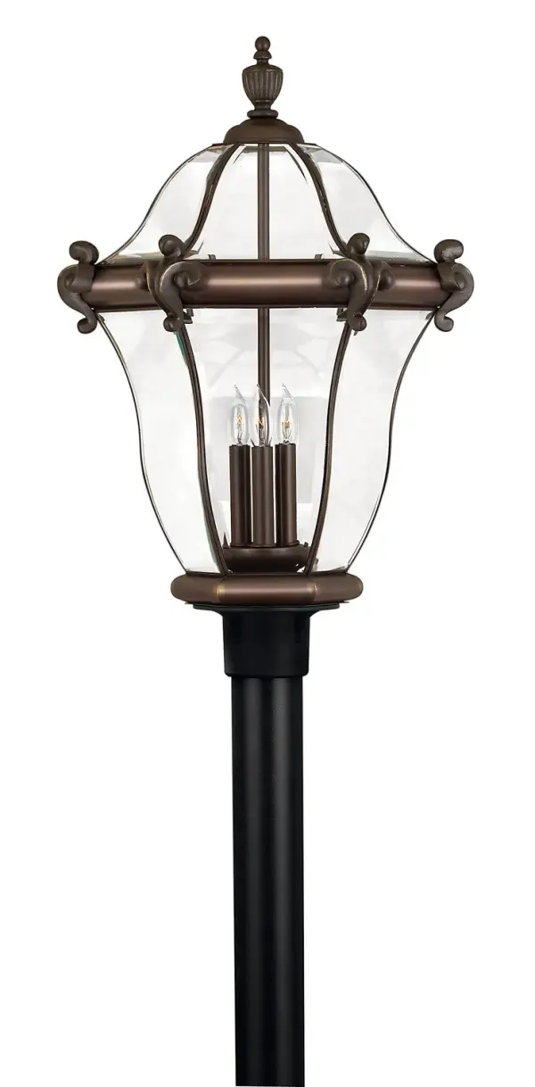 The San Clemente LED Post Lantern combines old-world craftsmanship with modern LED efficiency. Its cast aluminum and brass construction features ornamental detailing and distinctive beveled glass panels that create beautiful light patterns.