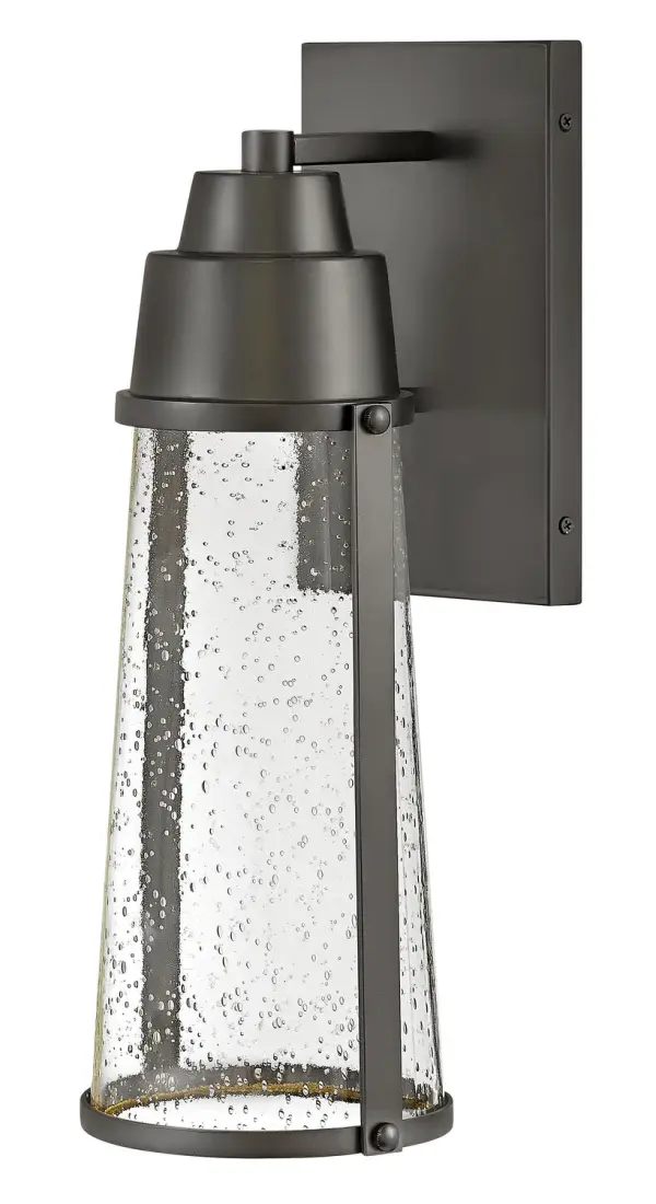 The Miles LED wall mount combines transitional design with coastal influences, featuring a layered cap detail and clear seedy glass. Wet-rated for true outdoor durability with an energy-efficient LED bulb included.