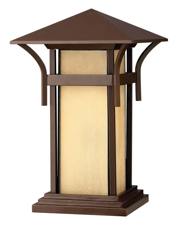 The Harbor LED Pier Mount brings coastal elegance to outdoor spaces with its lighthouse-inspired design. Cast aluminum and brass construction ensures durability, while etched amber seedy glass creates warm, welcoming illumination.