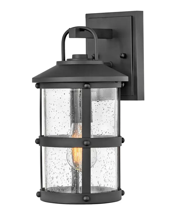 The Lakehouse LED wall sconce combines relaxed coastal style with practical durability. Cast aluminum construction and wet-rated certification make it ideal for exposed outdoor locations, while clear seedy glass adds character.