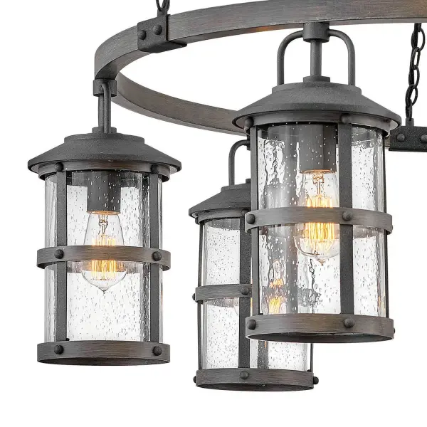 The look is relaxed, but the components of Lakehouse are quietly satisfying. Lakehouse features a distressed, Aged Zinc finish with clear seedy glass. Driftwood Grey finish rings add a wooden look to round out the coastal casual style. Cast aluminum construction ensures Lakehouse will withstand for years. Blissfully simple, yet all the details are memorable.
