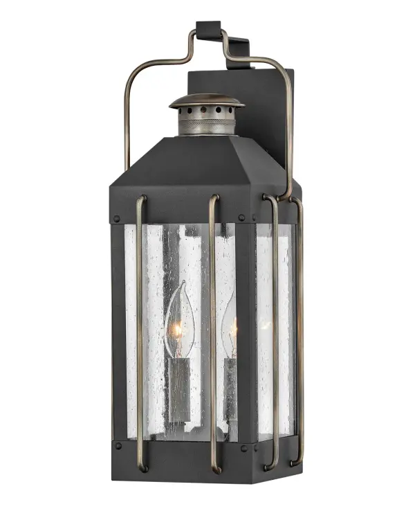 The Fitzgerald blends timeless traditional design with vintage 1970s flair in a compact outdoor wall sconce. Its textured black finish with burnished bronze wire accents creates visual interest while wet-rated construction ensures durability.