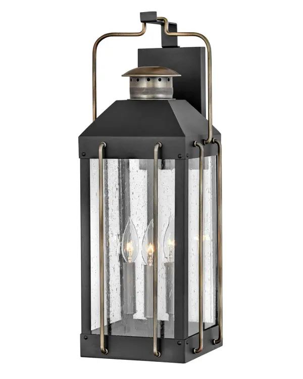 The Fitzgerald LED Wall Mount combines timeless traditional design with modern LED efficiency. Its textured black finish with bronze wire accents creates visual interest while the clear seedy glass adds vintage character.