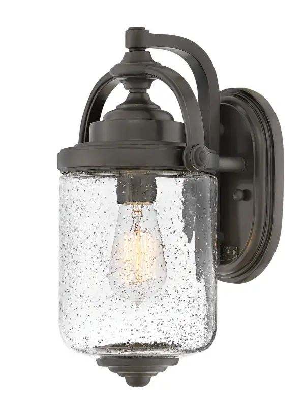 The Willoughby blends vintage lantern charm with contemporary LED technology. Its graceful curves, oversized seedy glass, and rust-resistant Oil Rubbed Bronze finish make it ideal for coastal and traditional outdoor settings.