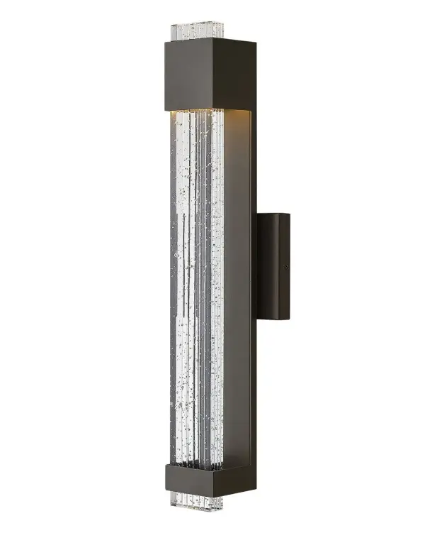 Glacier’s impressive form merges industrial and contemporary design elements into a breath-taking silhouette. A substantial block of clear seedy glass with etched grooves brilliantly channels light from the high-performance LED, which is held in suspension by the powder-coated aluminum frame.