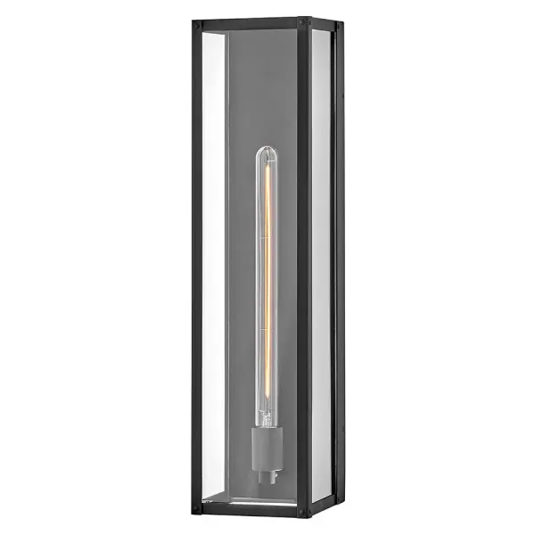 The Max LED Wall Sconce delivers contemporary elegance with its hand-welded aluminum frame and clear glass panels. Wet-rated for durability, this energy-efficient LED fixture brings architectural simplicity to any outdoor space.