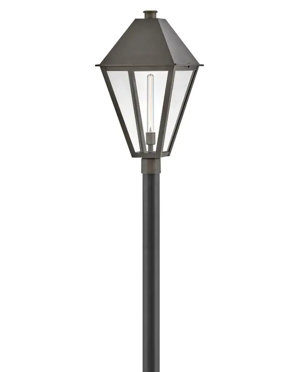 The Endsley LED Post Mount combines traditional architectural details with modern sensibility. Its oversized roof, simple chimney, and tall clear glass create a dignified presence, while the artisanal Blackened Brass finish adds sophisticated contrast. Energy-efficient LED technology and wet-rated construction make it both practical and beautiful.