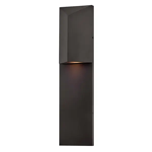 The Treva LED wall sconce combines architectural minimalism with practical outdoor lighting. Its Dark Sky compliance and wet rating make it ideal for eco-conscious exterior applications, while the refined finish transitions seamlessly indoors.