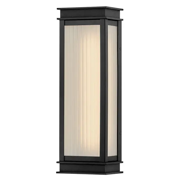 The Rockwell LED wall sconce combines classic lantern styling with modern integrated LED technology. Its ribbed glass and textured black finish create sophisticated curb appeal with energy-efficient illumination.