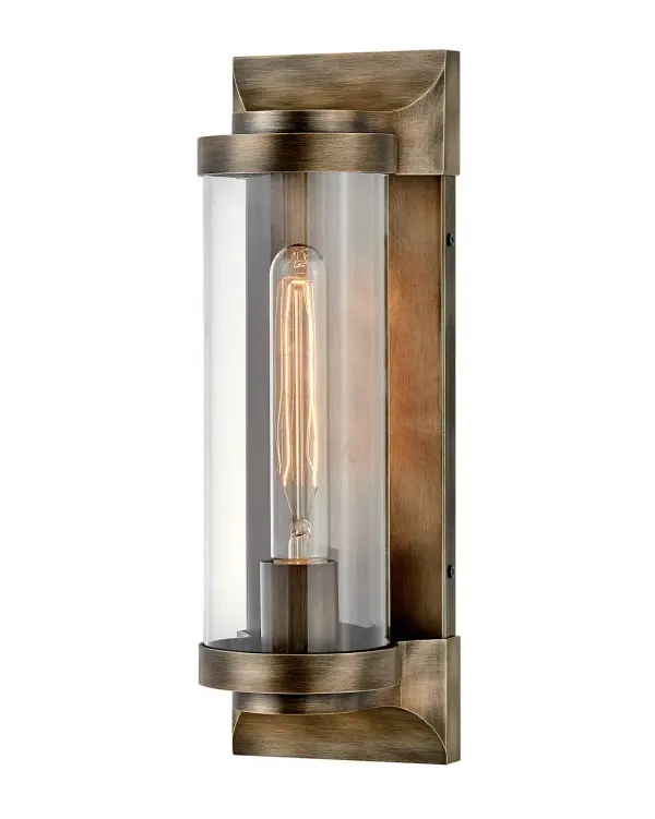 Take the indoor style of statement sconces outside. Drawing inspiration from the bygone era, Pearson emanates a feeling of nostalgia right outside your door. Featuring cast symmetrical end caps and clear cylindrical glass, Pearson combines the vintage look with a sleek backplate for the most sophisticated illumination in your outdoor living area. Available in a Burnished Bronze or Textured Black finish.