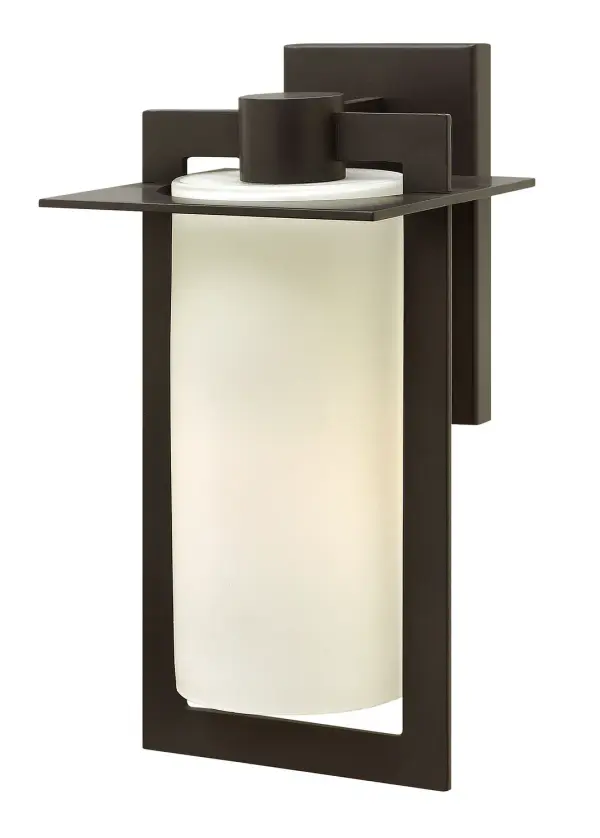 The Colfax LED wall sconce combines sleek geometric lines with warm bronze finish and etched opal glass. Its die-cast aluminum construction ensures durability for outdoor use, while the integrated LED provides energy-efficient illumination.