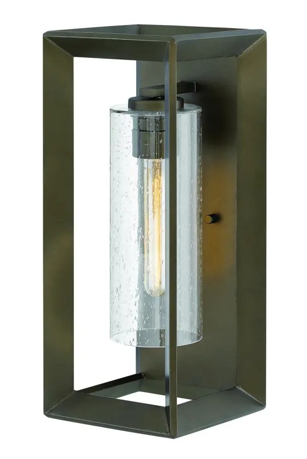 The Rhodes LED Wall Mount combines clean transitional design with practical wet-rated durability. Its warm bronze finish and clear seedy glass create inviting ambiance for both exterior and interior applications.