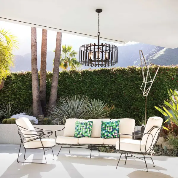 Reid uses an iconic profile featuring an airy, open cage to capture the center of attention. A candelabra with clear seedy glass columns highlights the transitional style, making it a modern mix of classic and contemporary. Weather-resistant metal with a Brushed Graphite finish complements any space, inside or out.