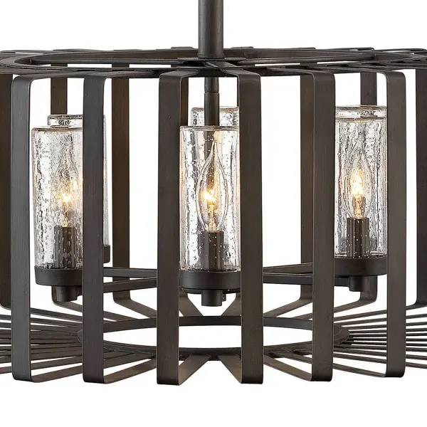 Reid uses an iconic profile featuring an airy, open cage to capture the center of attention. A candelabra with clear seedy glass columns highlights the transitional style, making it a modern mix of classic and contemporary. Weather-resistant metal with a Brushed Graphite finish complements any space, inside or out. - alternate view