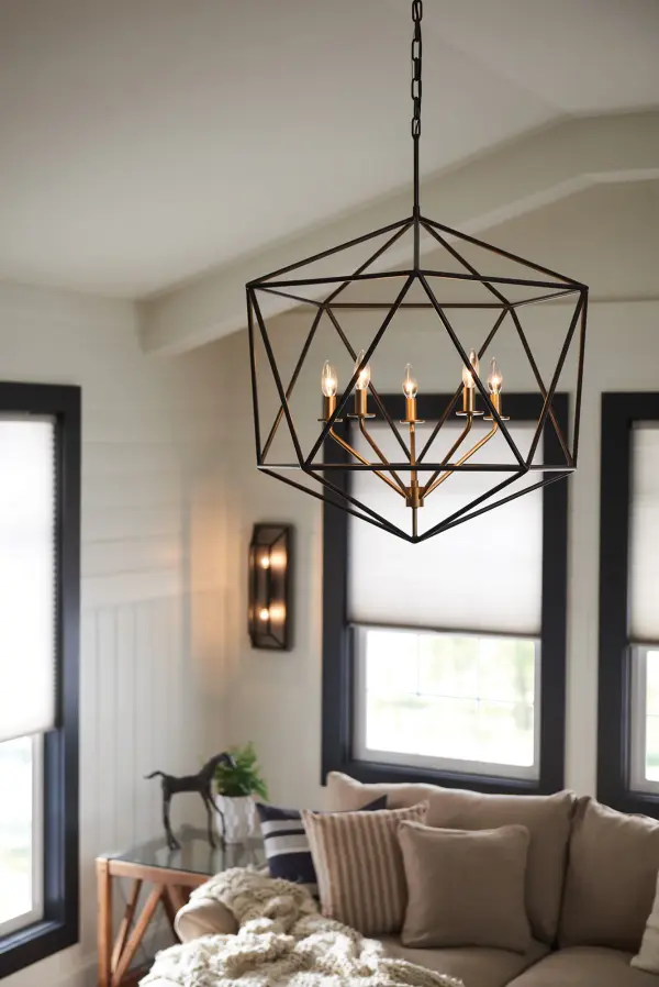 Sleek and chic, Astrid is designed as an airy geometric beauty balanced with robust welded construction. The inner light cluster, uniquely wired from the bottom, appears to float inside the outer cage. The two-tone finish further enhances the layering effect for added depth and dimension.