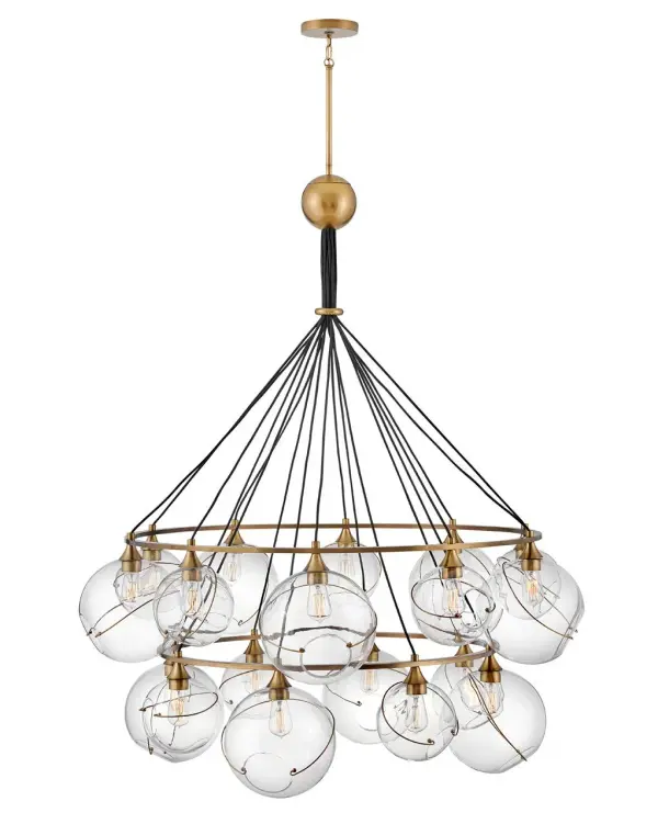 Mesmerizingly asymmetrical with a bohemian, midcentury modern flair, Skye showcases stunning globes of clear or cased opal glass with off-center openings. Slender rings and delicate details in Heritage Brass or Black finishes pull the look together, while adjustable wires allow you to create the perfect look for your space.