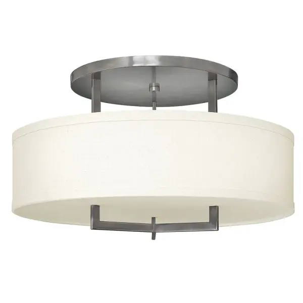 Hampton is a modern transitional design, offering the ultimate in urban sophistication. The minimal, rectangular frame, paired with a decorative acrylic etched bottom lens, is softened by a contemporary off-white linen drum shade.