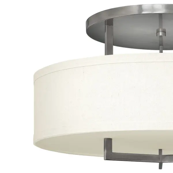 Hampton is a modern transitional design, offering the ultimate in urban sophistication. The minimal, rectangular frame, paired with a decorative acrylic etched bottom lens, is softened by a contemporary off-white linen drum shade. - alternate view
