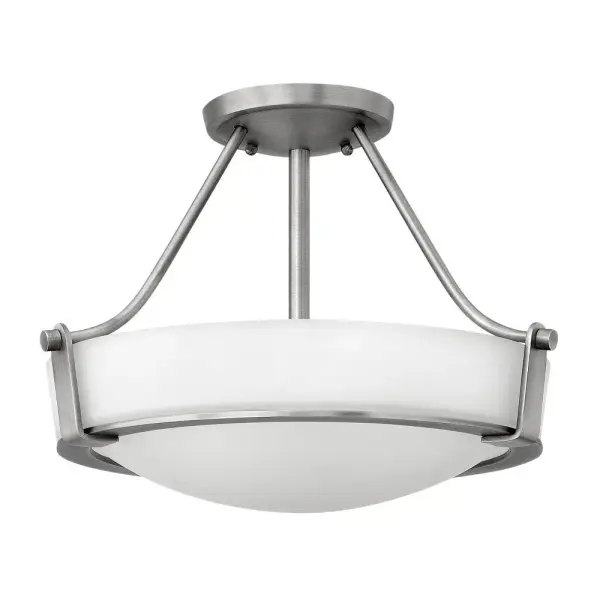 Hathaway’s striking design features a bold shade held in place by three intersecting, floating arms with unique forged uprights and ring detail for a modern style. Available in Heritage Brass with etched glass, Olde Bronze with etched glass, Olde Bronze with etched amber glass and Antique Nickel with etched glass.