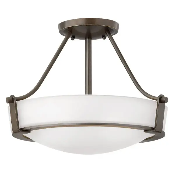 Hathaway’s striking design features a bold shade held in place by three intersecting, floating arms with unique forged uprights and ring detail for a modern style. Available in Heritage Brass with etched glass, Olde Bronze with etched glass, Olde Bronze with etched amber glass and Antique Nickel with etched glass.