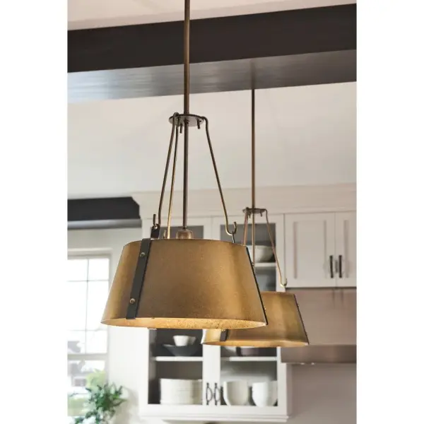 The Cartwright pendant collection captures a modern farmhouse aesthetic with its minimalist silhouette enriched by exquisite details and rich finishes. Contrasting straps are enhanced by bold rivets while robust hooks add a masculine elegance. - alternate view