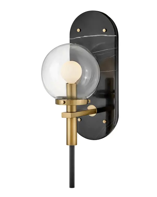 The Gilda LED sconce masterfully blends vintage charm with modern sophistication through its clear glass globe, brass accents, and striking marble backplate. Its plug-in or hardwire versatility makes it ideal for renters and homeowners alike.