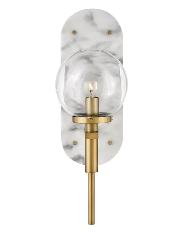 An alluring profile that blends a vintage and modern aesthetic, Gilda is the best of both worlds. This show-stopping sconce showcases a large clear glass globe atop a brass stem with contrasting rivets on a luxurious Black Marble or Faux Alabaster backplate. Gilda features a concealed on/off switch and removable cord and can be hardwired or plugged in. - alternate view