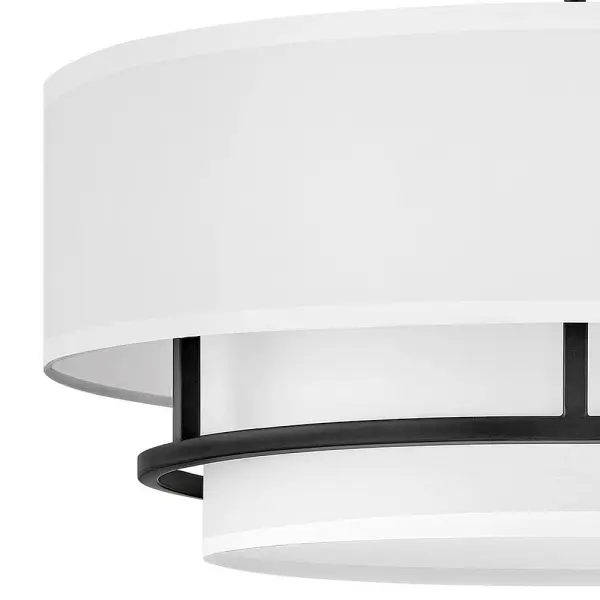 Handsome Graham is understated elegance, crafted with unique details making it the ultimate transitional semi-flush mount. Its welded frame is nestled between two off-white shades, in luminous faux parchment with a finished cluster visible from below. Graham is available in multiple finish options. - alternate view
